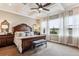 Main bedroom features a decorative ceiling, neutral color palette, and large windows with great views at 8651 S De Gaulle Ct, Aurora, CO 80016