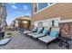 Relaxing outdoor patio featuring comfortable lounge chairs and a serene backyard view at 8651 S De Gaulle Ct, Aurora, CO 80016