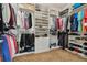 Organized walk-in closet with shelving and racks for clothing and accessories at 8651 S De Gaulle Ct, Aurora, CO 80016