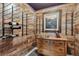Charming wine room with wooden walls, a wine rack, and a vintage chest of drawers at 8651 S De Gaulle Ct, Aurora, CO 80016