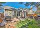 Spacious backyard featuring a barbecue grill, patio furniture, and lush grass at 18578 E Whitaker Cir # A, Aurora, CO 80015