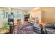 Inviting living room featuring hardwood floors, fireplace, and large windows, creating a cozy and bright atmosphere at 18578 E Whitaker Cir # A, Aurora, CO 80015
