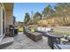 Outdoor living space with patio seating, fire pit, grill, and landscaped yard at 10065 Cairns Ct, Highlands Ranch, CO 80130