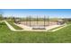 An outdoor baseball field featuring spectator seating and manicured lawn at 10065 Cairns Ct, Highlands Ranch, CO 80130