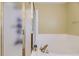 Bathroom features a soaking tub with a glass-enclosed shower at 10065 Cairns Ct, Highlands Ranch, CO 80130