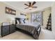 Bedroom featuring a comfortable bed, stylish decor, and a large window at 10065 Cairns Ct, Highlands Ranch, CO 80130
