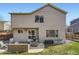 Rear exterior of house with patio seating, gas grill, and outdoor storage at 10065 Cairns Ct, Highlands Ranch, CO 80130