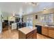 Open-concept kitchen flows to dining area with access to outdoor patio at 10065 Cairns Ct, Highlands Ranch, CO 80130
