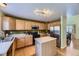 Well-equipped kitchen with stainless steel appliances, a center island, and ample counter space for meal preparation and dining at 10065 Cairns Ct, Highlands Ranch, CO 80130