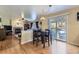 Bright open-concept floor plan with view to the living room and outdoor patio at 10065 Cairns Ct, Highlands Ranch, CO 80130