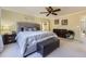 Spacious main bedroom features neutral colors and ample natural light at 10065 Cairns Ct, Highlands Ranch, CO 80130