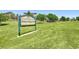 Wildcat Ridge Park with green signage, showcasing a large grassy field for activities at 10065 Cairns Ct, Highlands Ranch, CO 80130