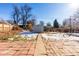 Spacious backyard with a shed and patio, perfect for outdoor activities at 4110 W Floyd Ave, Denver, CO 80236