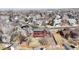 Aerial view of a neighborhood showcasing the home with a fenced backyard and mature trees at 1982 E 129Th Dr, Thornton, CO 80241