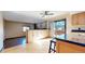 Open-concept kitchen area with sliding glass door to outdoor space, seamlessly flowing into adjacent spaces at 1982 E 129Th Dr, Thornton, CO 80241