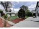 Landscaped backyard with a mix of mulch and grass, and a charming shed in a tranquil setting at 2389 Nome St, Aurora, CO 80010