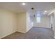 Finished basement features carpeting, closet space and overhead lighting at 2389 Nome St, Aurora, CO 80010