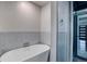 Contemporary bathroom features a sleek standalone tub and glass-enclosed shower at 2389 Nome St, Aurora, CO 80010