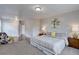 Bright bedroom with ample closet space and neutral carpet at 2389 Nome St, Aurora, CO 80010