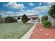 Charming single-story home featuring a well-maintained lawn and inviting front porch at 2389 Nome St, Aurora, CO 80010