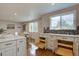 Modern kitchen with custom cabinets, pull out drawers, and stainless appliances at 2389 Nome St, Aurora, CO 80010