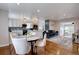 Open-concept living and dining space with hardwood floors and stylish decor at 2389 Nome St, Aurora, CO 80010