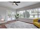 Bright sun room with large windows, french doors, and decorative plant at 2389 Nome St, Aurora, CO 80010