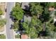 A bird's eye view of the property showcasing mature trees, the roof, the yard and the surrounding neighborhood at 8390 E Davies Pl, Centennial, CO 80112