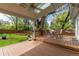 Covered deck overlooking beautiful landscaped backyard at 8390 E Davies Pl, Centennial, CO 80112