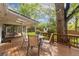 Wooden deck has outdoor seating with table and chairs at 8390 E Davies Pl, Centennial, CO 80112
