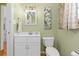 Charming bathroom with a vanity, toilet, framed mirror, and decorative artwork at 8390 E Davies Pl, Centennial, CO 80112