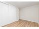 Bright bedroom with vinyl floors and closet at 8390 E Davies Pl, Centennial, CO 80112