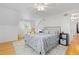 Cozy bedroom with neutral tones, hardwood floors, an area rug, and a ceiling fan at 8390 E Davies Pl, Centennial, CO 80112