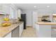 Well-lit kitchen with granite countertops, stainless steel appliances, and ample cabinet space at 8390 E Davies Pl, Centennial, CO 80112