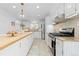 Modern kitchen with stainless steel appliances, granite countertops, and a large center island at 8390 E Davies Pl, Centennial, CO 80112