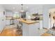 Bright and airy kitchen with a central island, stainless steel appliances, and plenty of counter space at 8390 E Davies Pl, Centennial, CO 80112