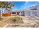 Exterior view showcasing the attached two car garage and front yard of the home at 1060 W 133Rd Cir # C, Denver, CO 80234