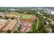 Wide aerial shot of the school featuring a football field, tennis courts and classrooms at 10009 Dodge Dr, Northglenn, CO 80260
