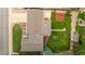 Aerial view of a well maintained house showing the roof, driveway, gardens, play area, storage shed and healthy green lawn at 10009 Dodge Dr, Northglenn, CO 80260