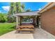 Backyard patio area with hot tub and picnic table offers a great outdoor entertaining space at 10009 Dodge Dr, Northglenn, CO 80260