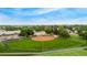 Aerial view of a neighborhood baseball field with green grass and baseball diamond at 10009 Dodge Dr, Northglenn, CO 80260