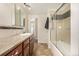 Bathroom featuring a shower and tub combo with tile backsplash, single sink, and tile flooring at 10009 Dodge Dr, Northglenn, CO 80260