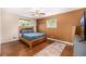 Primary bedroom features hardwood flooring, ceiling fan, and bright natural light at 10009 Dodge Dr, Northglenn, CO 80260