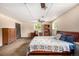 Spacious bedroom features an expansive ceiling, multiple windows, and comfortable furnishings, perfect for relaxation at 10009 Dodge Dr, Northglenn, CO 80260
