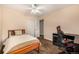 Inviting bedroom features natural light, a comfortable bed, and a dedicated desk space at 10009 Dodge Dr, Northglenn, CO 80260