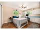 Bedroom featuring hardwood flooring, built in desk and cabinets, and natural light at 10009 Dodge Dr, Northglenn, CO 80260