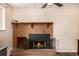 Classic brick fireplace with decorative mantel and hearth creates a cozy focal point in the room at 10009 Dodge Dr, Northglenn, CO 80260
