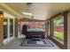 Covered outdoor hot tub with brick surround and privacy, perfect for relaxing after a long day at 10009 Dodge Dr, Northglenn, CO 80260