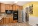 Bright kitchen with stainless steel appliances, including double door refrigerator and double oven at 10009 Dodge Dr, Northglenn, CO 80260