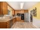 Traditional eat-in kitchen featuring stainless steel appliances and lots of cabinet space at 10009 Dodge Dr, Northglenn, CO 80260